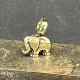 Height 2.5 cm.Stamped 925 s for sterling silver.Fine gilded elephant with glitter stone as ...