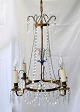 Swedish prism crown, 19th century. Brass, chains and prisms. In the middle, blue glass. ...