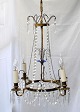 Swedish prism 
crown, 19th 
century. Brass, 
chains and 
prisms. In the 
middle, blue 
glass. ...