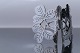 Belt buckle in silver, with a nice pattern shaped like clover leaves.