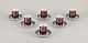 Bjørn Wiinblad (1918-2006) for Rosenthal, Germany. A set of six "Berlin Hilton" 
porcelain demitasse cups with saucers. Glossy copper-colored decoration.