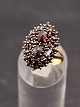 14 carat gold ring size 56 with numerous garnets item no. 558198