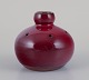 Gerard Hofmann (1917-1965), French ceramicist, own workshop. Perforated vase 
with ox blood glaze.