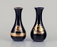 Limoges, 
France. Two 
porcelain vases 
decorated with 
22-karat gold 
leaf and 
beautiful royal 
blue ...