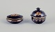 Limoges, 
France. Two 
porcelain 
lidded jars in 
porcelain, 
decorated with 
22-karat gold 
leaf and ...