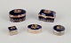 Limoges, France. Five miniature porcelain boxes, two with brass mounts, 
decorated with 22-karat gold leaf and a beautiful royal blue glaze. Scène 
galante.