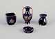 Limoges, 
France. Four 
pieces of 
porcelain 
miniatures, 
decorated with 
22-karat gold 
leaf and a ...