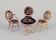 Limoges, France. Miniature table and chairs made of brass and porcelain, decorated with 22-karat ...