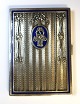 Austria. Silver 
case with blue 
enamel (950). 
Length 8.2 cm. 
Width 6 cm.