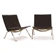 Pair of Poul 
Kjærholm PK22 
lounge chairs 
with black 
leather and 
steel frame