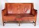 The vintage design two-seater sofa model 5011 created by Kaare Klint. This iconic piece is ...