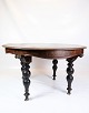Mahogany dining table with round legs with carvings from around the 1880s.Dimensions in cm: ...