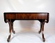 Mahogany dining table with flaps and brass decoration, as well as a drawer with key from around ...
