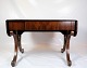 Mahogany dining 
table with 
flaps and brass 
decoration, as 
well as a 
drawer with key 
from around ...