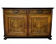Light mahogany sideboard with 2 doors and 2 drawers and round legs from around the ...
