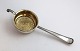 Old danish. 
Silver Tea 
strainer (830). 
Gilded inside. 
Length 16 cm.
