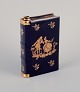 Limoges, 
France. 
Porcelain "hip 
flask" shaped 
like a book 
decorated with 
22-karat gold 
leaf and ...