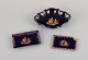 Limoges, 
France. Bowl 
and two small 
trays in 
porcelain. 
Decorated with 
22-karat gold 
leaf and ...