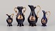 Limoges, 
France. Three 
pitchers and a 
vase in 
porcelain 
decorated with 
22-karat gold 
leaf. ...