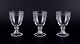 Val St. Lambert, Belgium. A set of three red wine glasses in mouth-blown crystal 
glass.