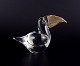 Murano, Italy. Small art glass sculpture of a toucan in clear glass with a gold-colored glass ...