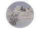 Royal 
Copenhagen Art 
Nouveau plate 
decorated with 
flying swans.
The factory 
mark tells, 
that ...