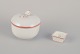 Meissen, Germany. A sugar bowl and a salt cellar. Decorated with coral red and 
gold-colored trim. Art Deco.