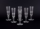 A set of six 
mouth-blown 
French 
champagne 
flutes in ...