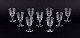 A set of nine mouth-blown French sherry glasses in crystal glass.