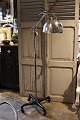 Old floor lamp on wheels in chrome with a fine patina. The lamp can be adjusted in height from ...