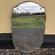 Mirror in a nice shape mounted on a wooden board. Dimensions: 62x37 cm