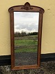 Large mirror in 
a fine wooden 
frame. Height: 
125 cm, width 
63 cm. Has 
previously been 
mounted ...