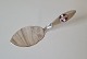Cake shovel in silver decorated with Ebeltoft Marineforening's logo in enamelStamped the tree ...