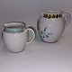 Two 
hand-painted 
ceramic jugs. 
The large one 
for water or 
milk, the small 
one for cream. 
Both ...