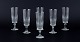 A set of six 
Swedish 
Champagne 
flutes in clear 
glass. Faceted. 

Circa 1930s. 
Perfect ...