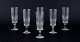 A set of six 
Swedish 
Champagne 
flutes in clear 
glass. ...