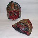 Pair of decorative painted masks In ceramics. Both appear to be in good condition with no damage ...