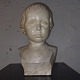 Bust of boy's 
head in 
patinated 
plaster. Done 
by an unknown 
artist who 
signed the bust 
with B. ...