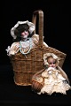 2 fine old dolls with porcelain heads, real hair and fine lace fabric dresses.Doll no. 1) H: ...