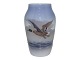 Small Royal Copenhagen vase with flying duck.The factory mark tells, that this was produced ...