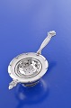 Acorn Georg 
Jensen sterling 
silver. Johan 
Rohde Tea 
strainer.  
Tea stand # 
662, height 2.9 
cm. ...