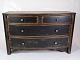 Black Painted 
chest of 
drawers with 
curved front 
and 4 drawers 
with patina 
from around the 
...