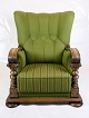 A high-backed 
armchair from 
the Renaissance 
period 
upholstered in 
green fabric 
and decorated 
...