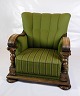 An armchair 
from the 
Renaissance 
period 
upholstered in 
green fabric 
and decorated 
with handmade 
...