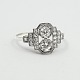 Ring of 18k 
white gold in 
art deco style. 
Set with 2 
larger 
diamonds, with 
a total of 0.40 
ct. W ...