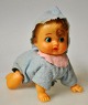 Doll with 
pull-up for 
crawling. West 
German. The 
1950s. H: 14 
cm. L: 13 cm. 
W: 7.5 cm.