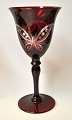 Red Bohemian 
wine glass, 
20th century. 
Clear glass 
mass with red 
overlay. 3 
Grindings in 
the ...