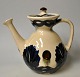 Herman A. 
Kähler teapot, 
1930s, Næstved, 
Denmark. With 
blue, black and 
red glazes on a 
cream ...