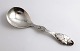 Danish work. 
Serving spoon 
with amber 
(830). Length 
17.5 cm. 
Produced 1915.
