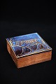 Box from the 60s in rosewood with glazed ceramic lid in blue colors with motif 
of an "Apis Taurus"...